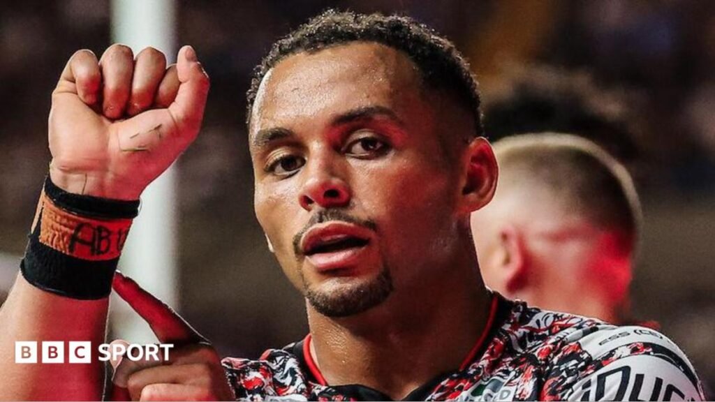 Super League: Leeds Rhinos 16-20 Leigh Leopards – Leopards ruin Leeds’ 100% home record Leigh Leopards' Umyla Hanley celebrating scoring with his right hand raised