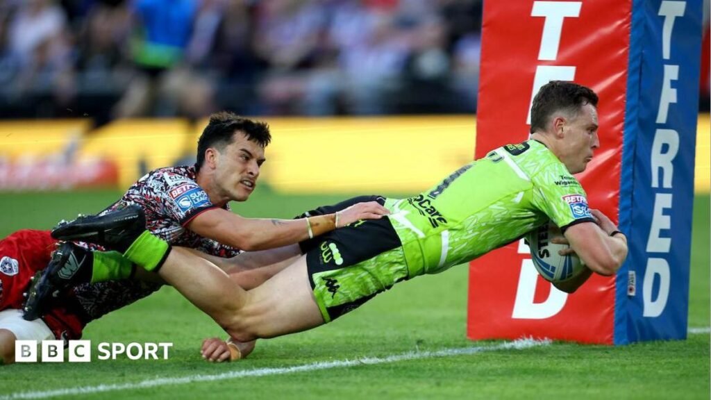 Super League: Leigh Leopards 8-20 Wigan Warriors Wigan full-back Jai Field dives over the line to score against Leigh despite the attentions of Leopards wing David Armstrong