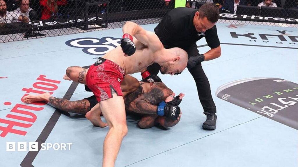 Uros Medic throws punches at Daniel Rodriguez, who covers up and lies on the canvas