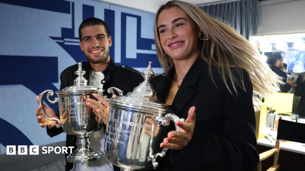 Carlos Alcaraz and Aryna Sabalenka pose with their US Open singles trophies