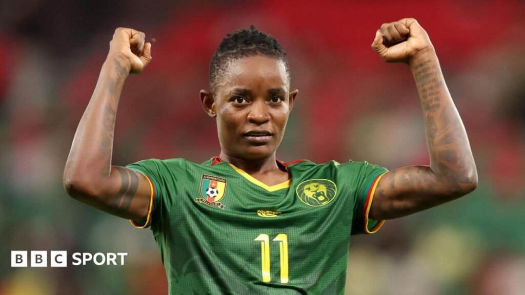 Wafcon 2026 final: Cameroon 3-0 Malawi – Marie Ngah Manga helps Indomitable Lionesses to first title Marie Ngah Manga, wearing a green Cameroon shirt with a yellow number 11 on the chest, holds up both arms with fists clenched in celebration