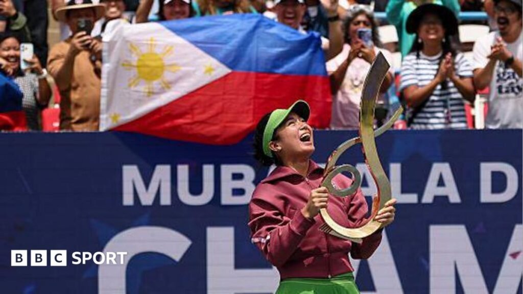 Alexandra Eala holds the trophy after beating Jessica Pegula to win the Mubadala DC Open in 2026