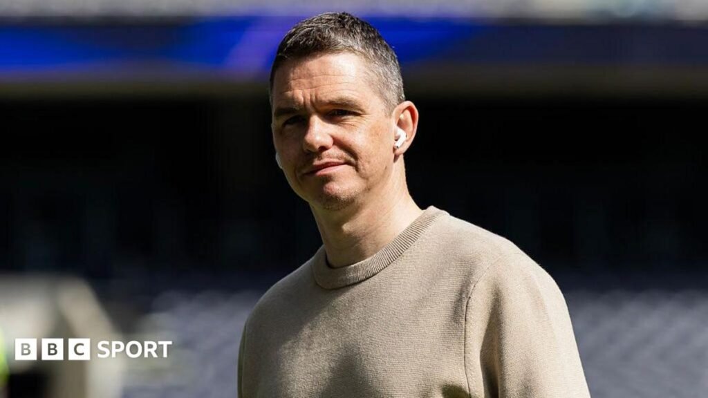 Women’s Super League: Manchester United boss Marc Skinner leaves role Close up image of Marc Skinner wearing in-ear headphones