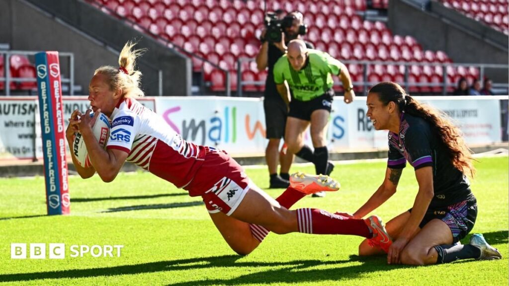 Women’s Super League: St Helens 6-44 Wigan Warriors – Wigan hammer Saints Wigan Warriors' Anna Davies (left) diving into the corner with a St Helens defender on her knees unable to stop her