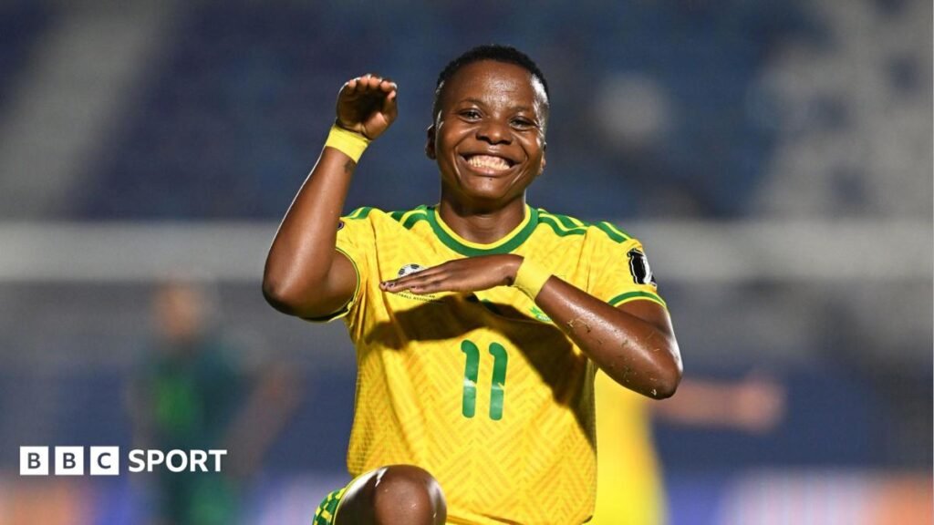 Women’s World Cup 2027: Nigeria miss out as South Africa and Ghana win Wafcon African play-offs Thembi Kgatlana of South Africa smiles directly into the camera and strikes her trademark 'snake' celebration pose which sees her lift her right arm up with the hand tilted over as if to mimic a snake's head, with the left arm crossed horizontally across her chest and also with one knee raise off the floor up to waist level