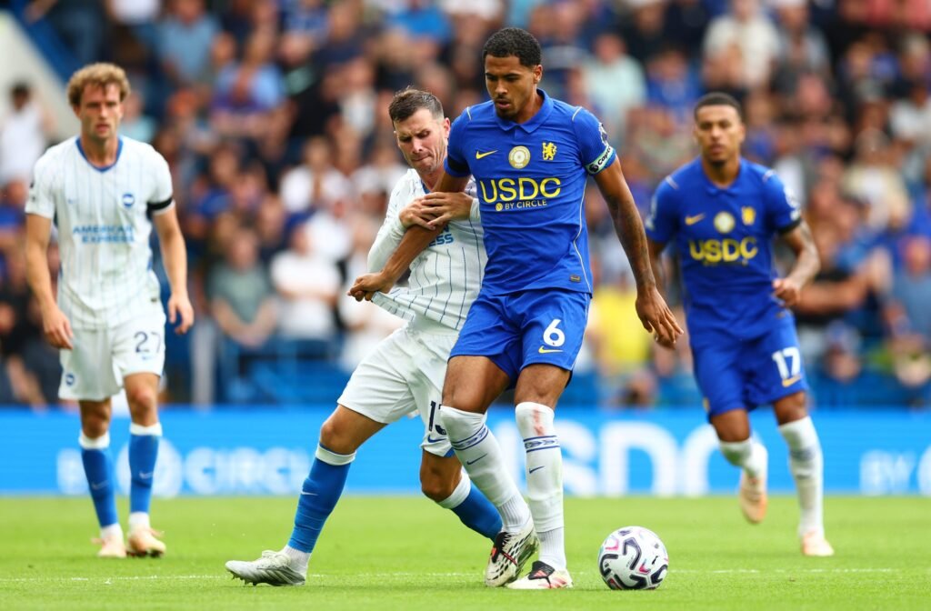 Levi Colwill of Chelsea is challenged by Pascal Gross of Brighton & Hove Albion