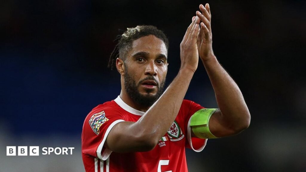 Ashley Williams applauds the Wales supporters
