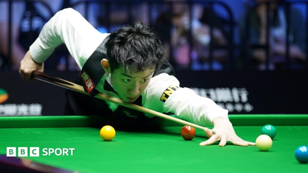 British Open: Wu Yize to face Kyren Wilson in second round Snooker player Wu Yize takes aim as he plays a shot
