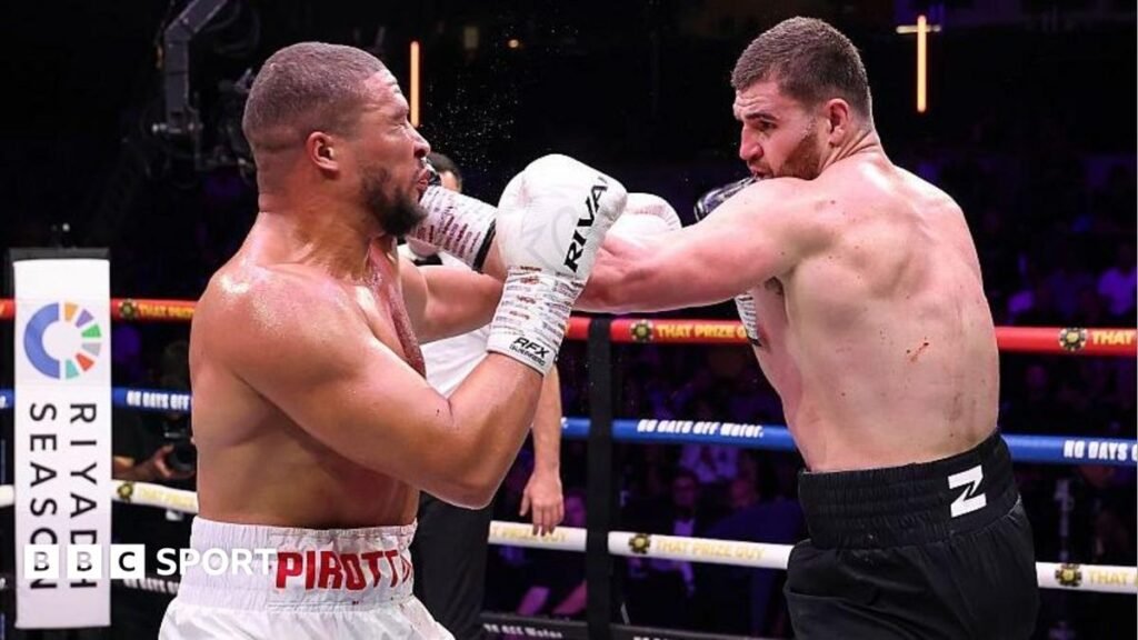 Johnny Fisher lands a punch on Michael Pirotton