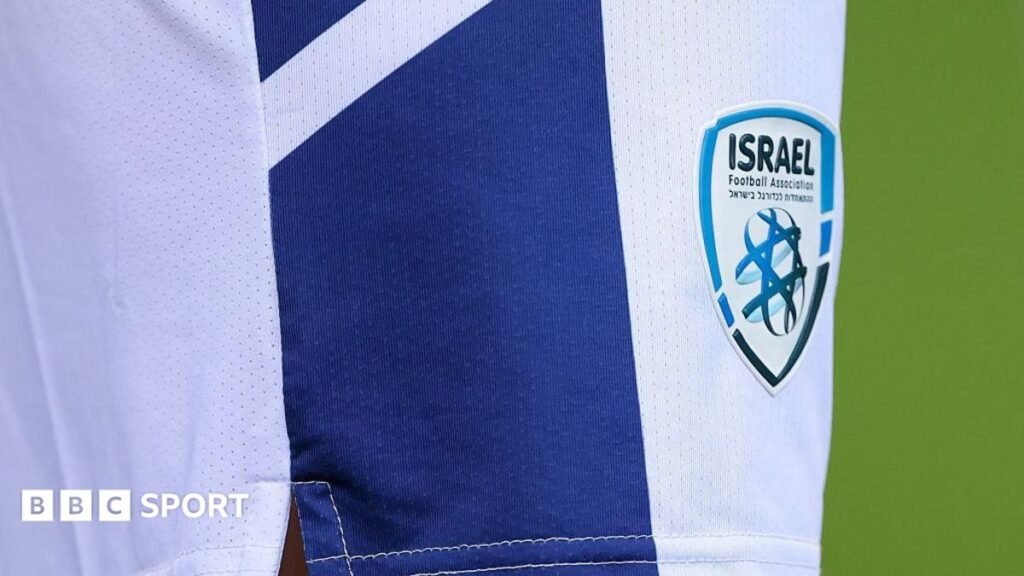 A close-up shot of the badge of the Israel Football Association on the shorts of a national team player during an international fixture