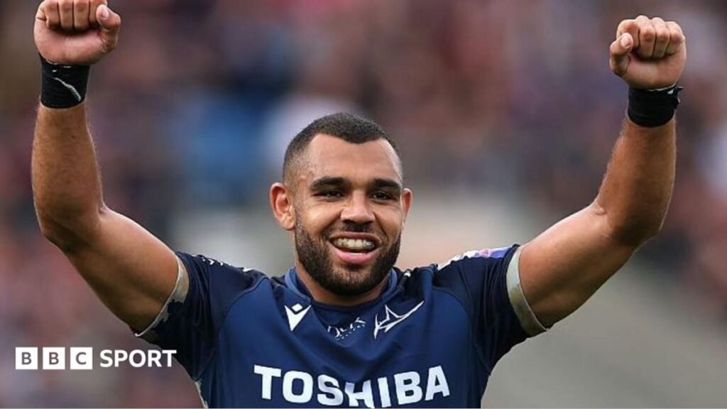 Joe Marchant raises his arms in celebration