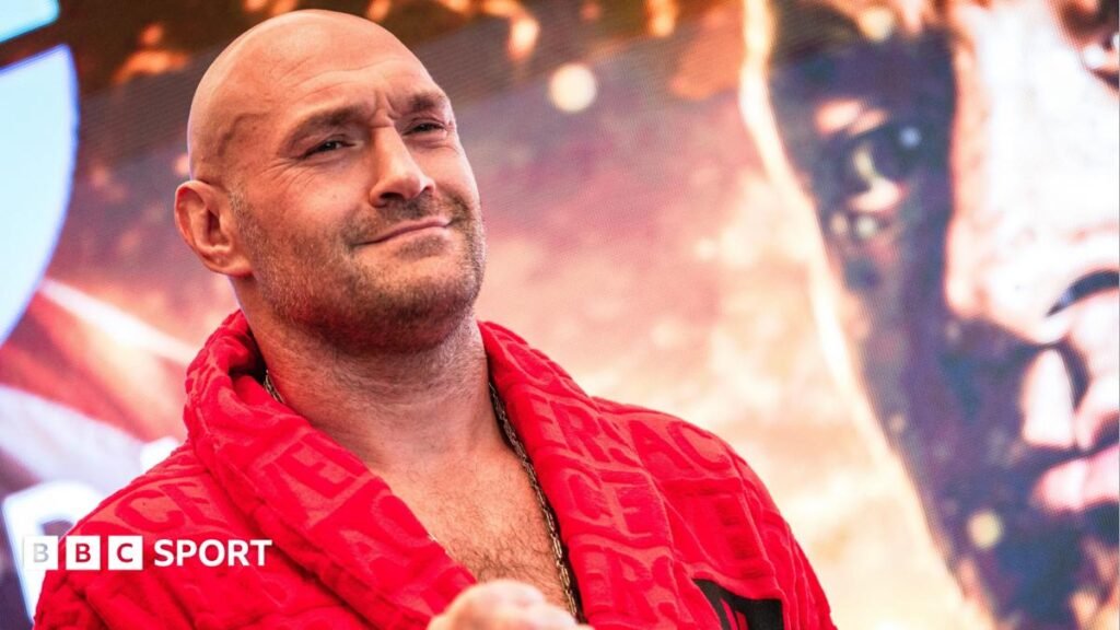 Joshua vs Fury: Tyson Fury says he is looking for new opponent and calls out Oleksandr Usyk Tyson Fury holds up his hand and is wearing a boxing glove and Anthony Joshua holds up two fingers and has a Union Jack over his shoulders