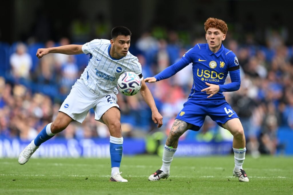 Diego Gomez of Brighton and Hove Albion is challenged by Valentin Barco of Chelsea