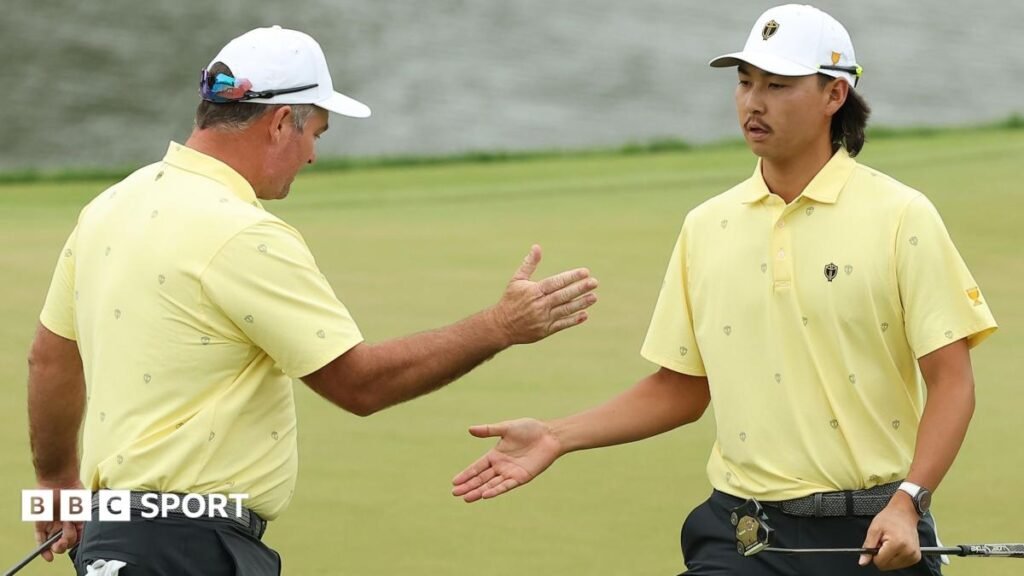 Ryan Fox of New Zealand and the International Team and Min Woo Lee of Australia give each other a high five