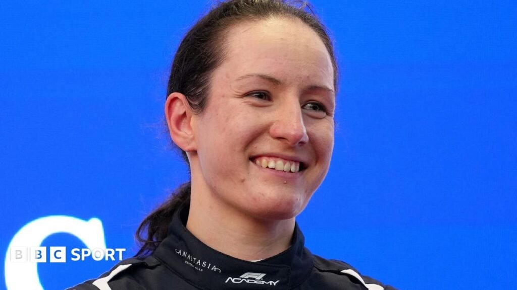 Alisha Palmowski celebrating in parc ferme with her race engineer after winning the F1 Academy title