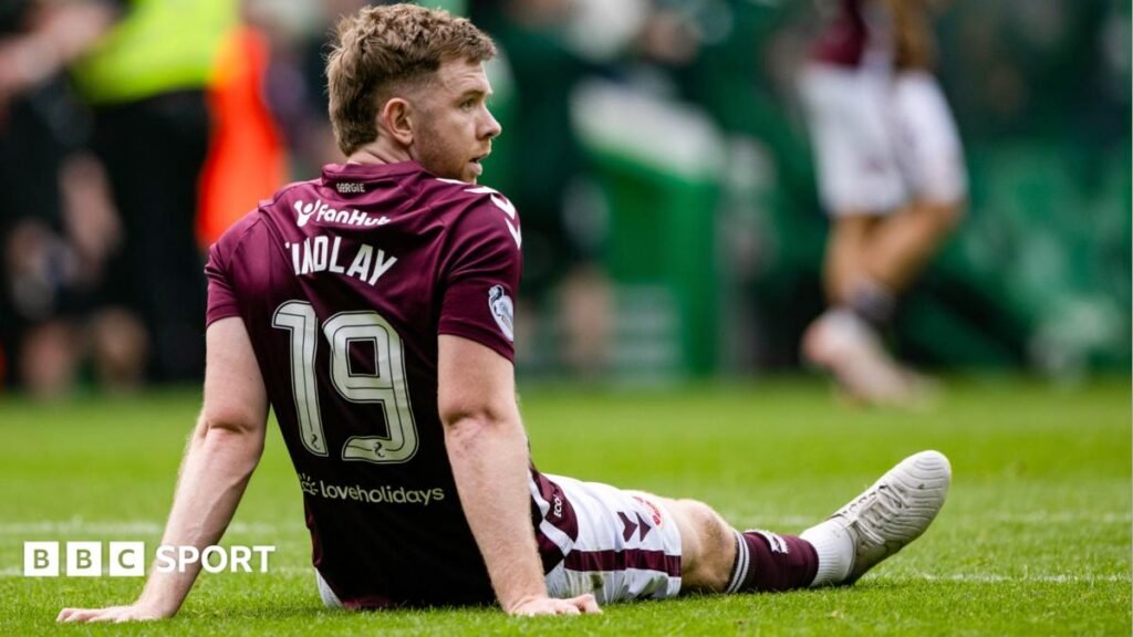 Hearts defender Stephen Kingsley pictured dejected at Celtic Park