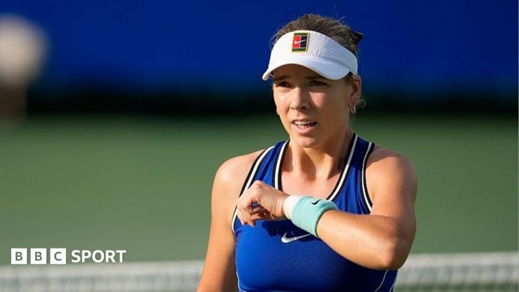 Katie Boulter, wearing a blue dress and white visor