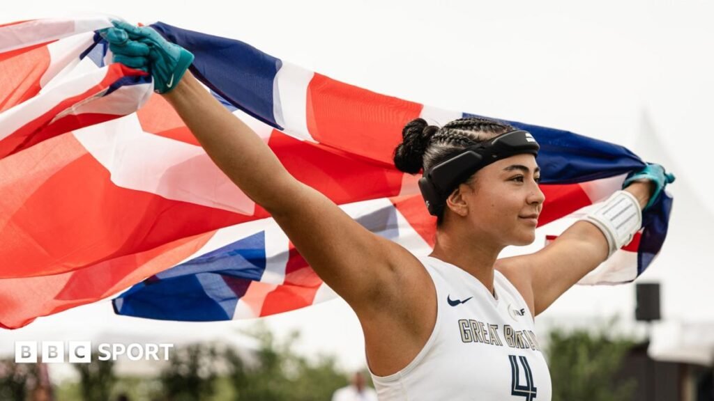 Angelica Tait holds a Great Britain flag aloft during the 2026 Flag Football World Championships