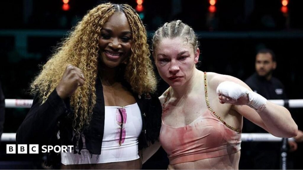 Claressa Shields and Lauren Price pose for pictures in the boxing ring
