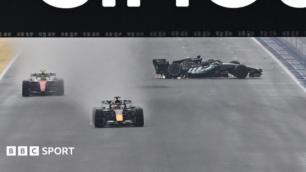 The Mercedes of George Russell spins on the start-finish straight as Red Bull's Max Verstappen and Ferrari's Lewis Hamilton go past during the Singapore Grand Prix sprint race