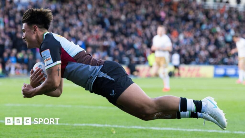 Marcus Smith dives over the line for the opening Harlequins try against Saracens